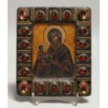 A GOOD SMALL RUSSIAN ICON, MADONNA AND CHILD, the frame inset with semi-precious stones. 7ins x 6ins