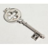 A TIFFANY WHITE GOLD DIAMOND SET KEY. 5cm long in original pouch and box.