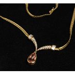 AN 18CT GOLD GARRARD'S IMPERIAL TOPAZ AND DIAMOND NECKLACE.