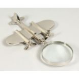 A MOULDED CHROME AEROPLANE MAGNIFYING GLASS.