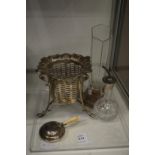 A pierced silver basket and other items.