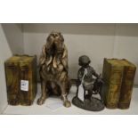A pair of alabaster book shaped bookends, a spelter figure of a girl and a goat and a model of a