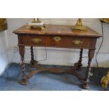 An 18th century walnut single drawer side table (AF).