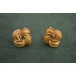 A pair of knot style earrings for pierced ears, stamped 18ct. 15 grams