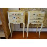 A pair of cream painted three drawer bedside chests.