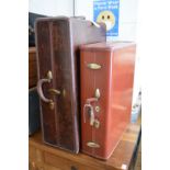 An old Samsonite wardrobe trunk and similar suitcase.