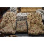 A pair of Victorian style button upholstered armchairs with matching footstool.