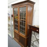 An oak cupboard bookcase.