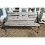 A garden bench with metal ends.