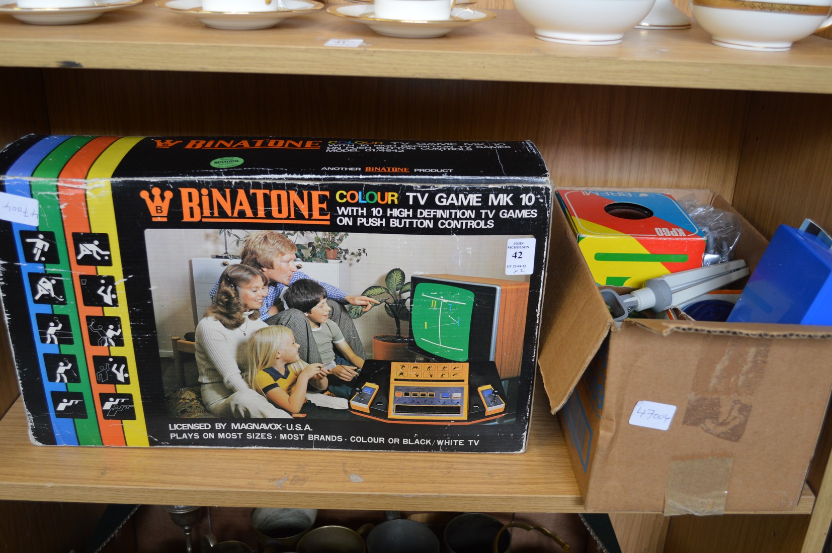 A Binatone TV game, boxed and other items.