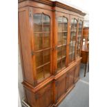 A large oak breakfront cupboard bookcase.