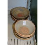 Six small Chinese terracotta bowls.