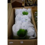A quantity of green cut glass lampshades.