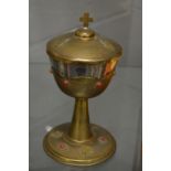 A continental silver and gilt decorated chalice and cover.