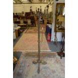 An ornate floor standing lamp.