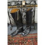 A pair of leather riding boots, size 7D.