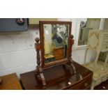 A walnut dressing table mirror.