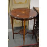 An inlaid mahogany circular occasional table.