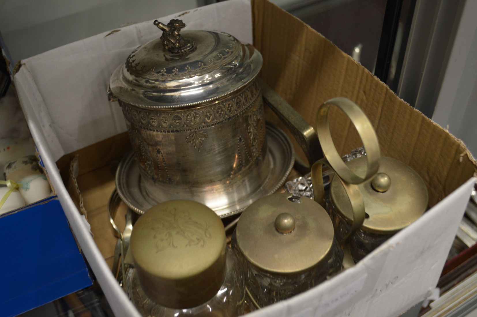 A plated biscuit barrel and other items.