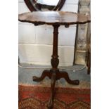 A mahogany tripod table.