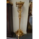 A highly ornate ormolu floor standing stand, the column modelled as a female caryatid figure.