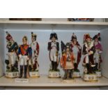 Porcelain military figurines and a pirate king.