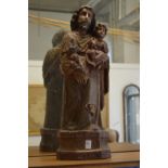 An 18th century Italian carved, gessoed and painted figure of Joseph and the Infant Jesus.