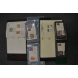 Four stamp albums and contents.