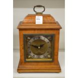 A small walnut cased bracket clock by Mappin & Webb.