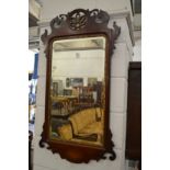 A mahogany fretwork framed wall mirror.