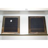 A pair of large silver plated photograph frames.