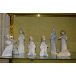 A group of Lladro figurines.