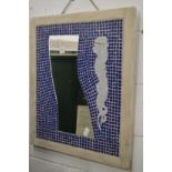 A decorative tiled mirror.