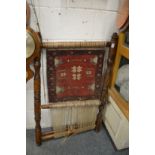 An unusual part made Persian rug on a loom.