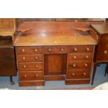 A Victorian mahogany kneehole desk.