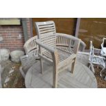 A set of four children's teak garden armchairs.