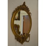 A good 19th century gilt framed oval girandole mirror.