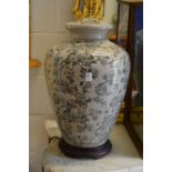 A large pair of Chinese style urn shaped pottery table lamps.