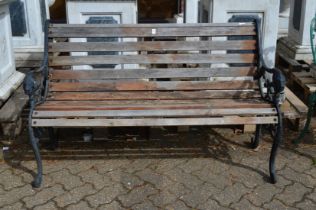 A garden bench with metal ends.