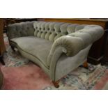 A good Victorian Chesterfield style serpentine fronted settee, the castors stamped C. Hindley &