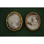 Two cameo brooches.