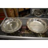 A pair of plated serving dishes with glass liners.