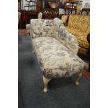 A small chaise longue together with a matching upholstered ottoman and bedroom chair.