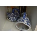 A pair of Chinese blue and white fish shaped dishes or vases.