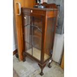 A mahogany display cabinet.