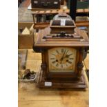 A walnut mantle clock (AF).