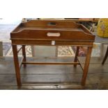 A mahogany rectangular tray table.