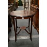 A mahogany circular occasional table.