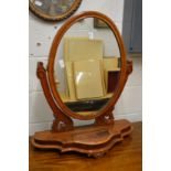 A Victorian walnut dressing table mirror.