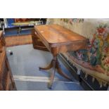 A Regency style mahogany pedestal foldover card table.